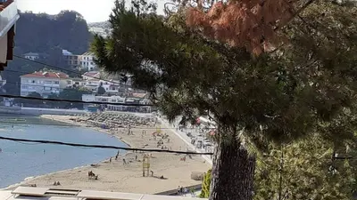 a beach with a bunch of people on it at Family House Milic in Ulcinj in Ulcinj