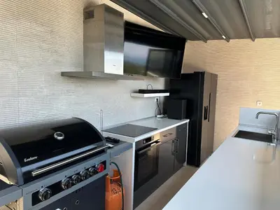 a kitchen with a stove and a sink in it at Villa Azure Krimovica Kotor in Krimovice