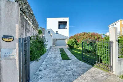 a gate to a house with a stone walkway at Villa Azure Krimovica Kotor in Krimovice