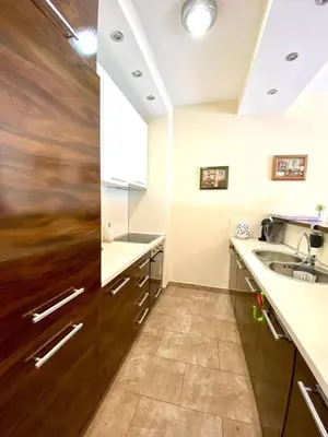 a kitchen with a sink and a counter top at Orhid apartment Becici one in Budva