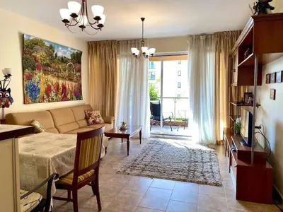a living room with a bed and a couch at Orhid apartment Becici one in Budva