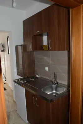 a kitchen with a sink and a counter top at Studios Seaview in Dobra Voda
