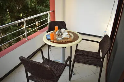 a small table and two chairs on a balcony at Apartments Contessa in Ulcinj