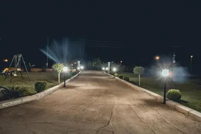 an empty street at night with street lights at Apartments Contessa in Ulcinj