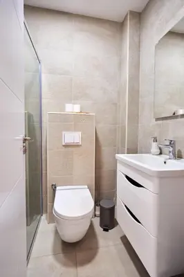 a bathroom with a toilet and a sink at Casa Collection in Tivat