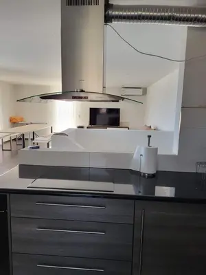a kitchen with a sink and a stove top oven at Apartmani Sutomore Tri Palme in Sutomore