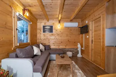 a living room with a couch and a table at Oasis of Peace in Cetinje