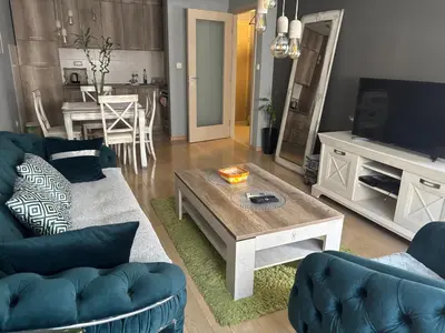 a living room with a couch and a coffee table at NADJA Apartman City Kvart in Kruševac