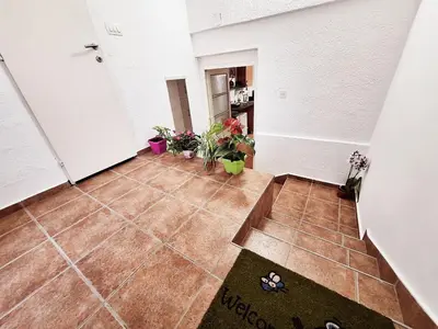 an empty hallway with plants in a room at Melody apartment in Podgorica