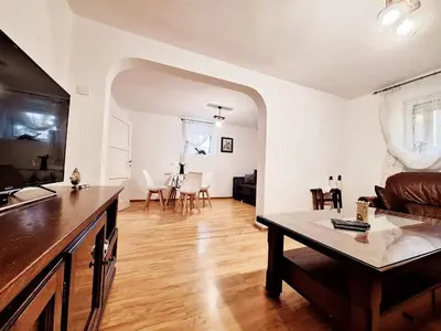 a living room with a couch and a table at Melody apartment in Podgorica
