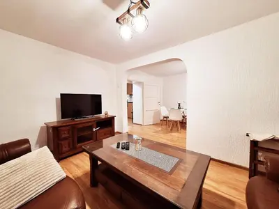 a living room with a couch and a table at Melody apartment in Podgorica