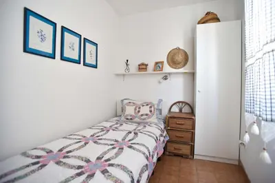 a bedroom with a bed and a dresser at OLD TOWN 5 apartment in Budva