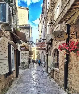an alley with people walking down a street at OLD TOWN 5 apartment in Budva