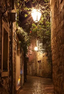 an alley at night with a street light at Budva OLD TOWN 4 apartment in Budva