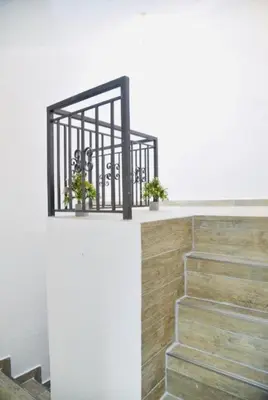 a staircase with two potted plants on a wall at Budva OLD TOWN 4 apartment in Budva