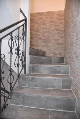 a staircase with stone steps and a brick wall at Budva OLD TOWN 4 apartment in Budva