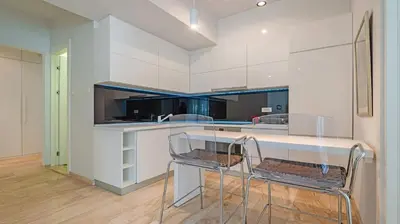 a kitchen with a glass table and two chairs at PREMIUM Tre canne apart 