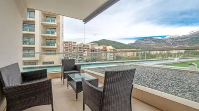 a balcony with a table and chairs and a large window at PREMIUM Tre canne apart 