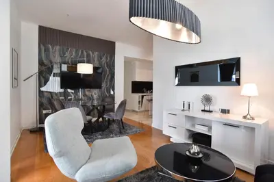 a living room with a table and chairs at PREMIUM Tre canne apart 