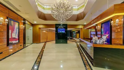 a large lobby with a chandelier in a building at Apartment with 2 rooms in Tre canne hotel in Budva
