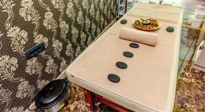 a counter with a table with a plate of food on it at Apartment with 2 rooms in Tre canne hotel in Budva