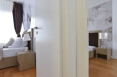 a bedroom with a bed and a window at Apartment with 2 rooms in Tre canne hotel in Budva