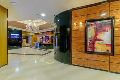 a lobby with a painting on a wall at Two rooms in Tre canne hotel in Budva