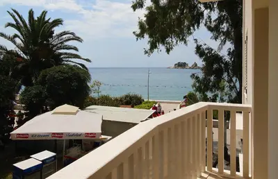a view of the ocean from a balcony of a house at Apartments Dangubic in Petrovac na Moru