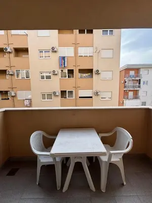 a table and two chairs in front of a window at Studio 23 in Podgorica