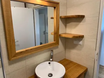 a bathroom with a sink and a mirror at Alex Apartments in Budva