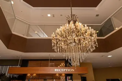 a chandelier hanging from the ceiling of a hotel at Luxury 3 bedroom private apt in beachfront Hotel in Budva