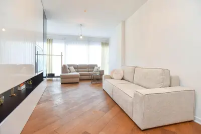 a living room with a couch and a table at Prometheus Apartments in Budva