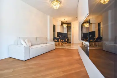 a living room with a couch and a dining room at Prometheus Apartments in Budva