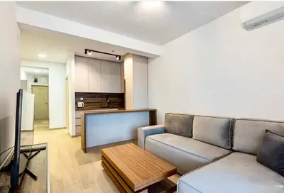 a living room with a couch and a table at Montenegro at the Green Stone beach in Budva