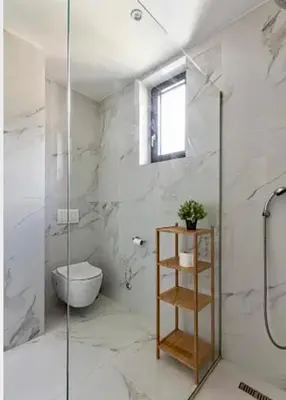 a bathroom with a toilet and a glass shower at The best view in Montenegro in Budva