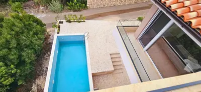 an overhead view of a swimming pool on a house at Sweet Sea Villa in Utjeha