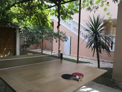 a wooden table with a hat on top of it at Apartments Montenegrina in Ulcinj