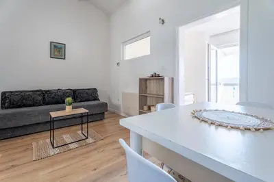 a living room with a couch and a table at Apartments Miki in Bar