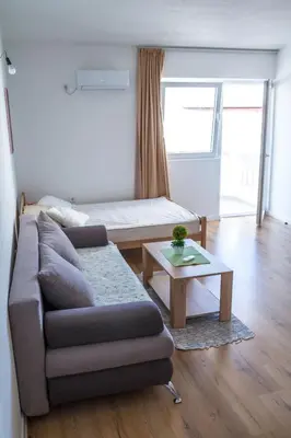 a living room with a couch and a coffee table at Apartments Miki in Bar
