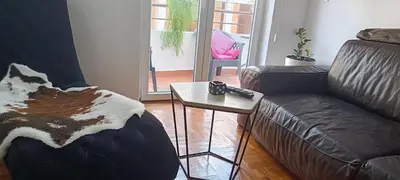 a living room with a couch and a coffee table at Budva apartman Haustor in Budva
