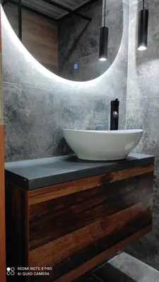 a bathroom with a sink and a mirror at Budva apartman Haustor in Budva