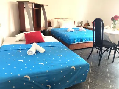 a room with two beds with stuffed animals on them at Apartments Radosevic in Ulcinj