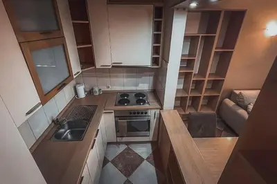 a small kitchen with a stove and a sink at Apartment Podgorica Center in Podgorica