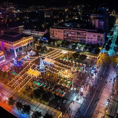 an overhead view of a market in a city at night at Apartment Podgorica Center in Podgorica