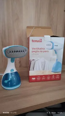 a remote control next to a box on a table at Vincent Van Gogh in Podgorica
