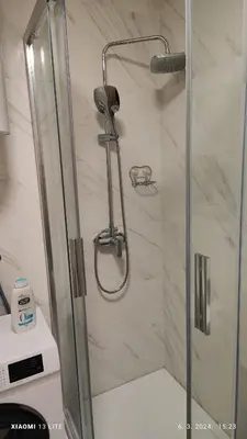 a shower with a glass door in a bathroom at Vincent Van Gogh in Podgorica