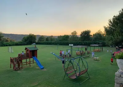 a group of children playing on a playground at Shasi Eco Lodge in Ambula