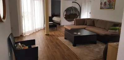 a living room with a couch and a coffee table at Vila Kajevic in Ulcinj