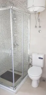 a bathroom with a toilet and a glass shower at Vila Kajevic in Ulcinj