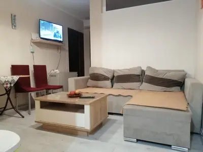 a living room with a couch and a table at Квартира 200м от моря. in Bar